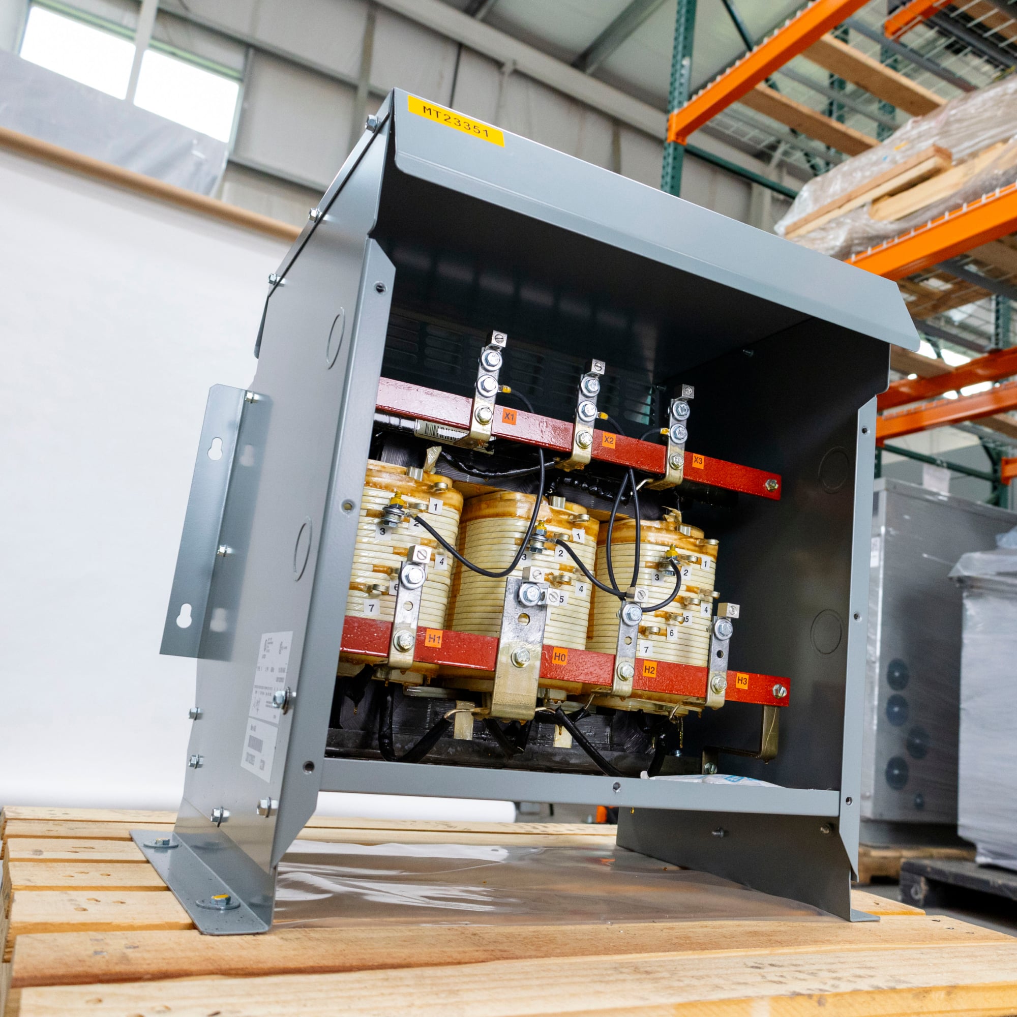 A relevant stock photo of 3 phase transformer in a typical setting.