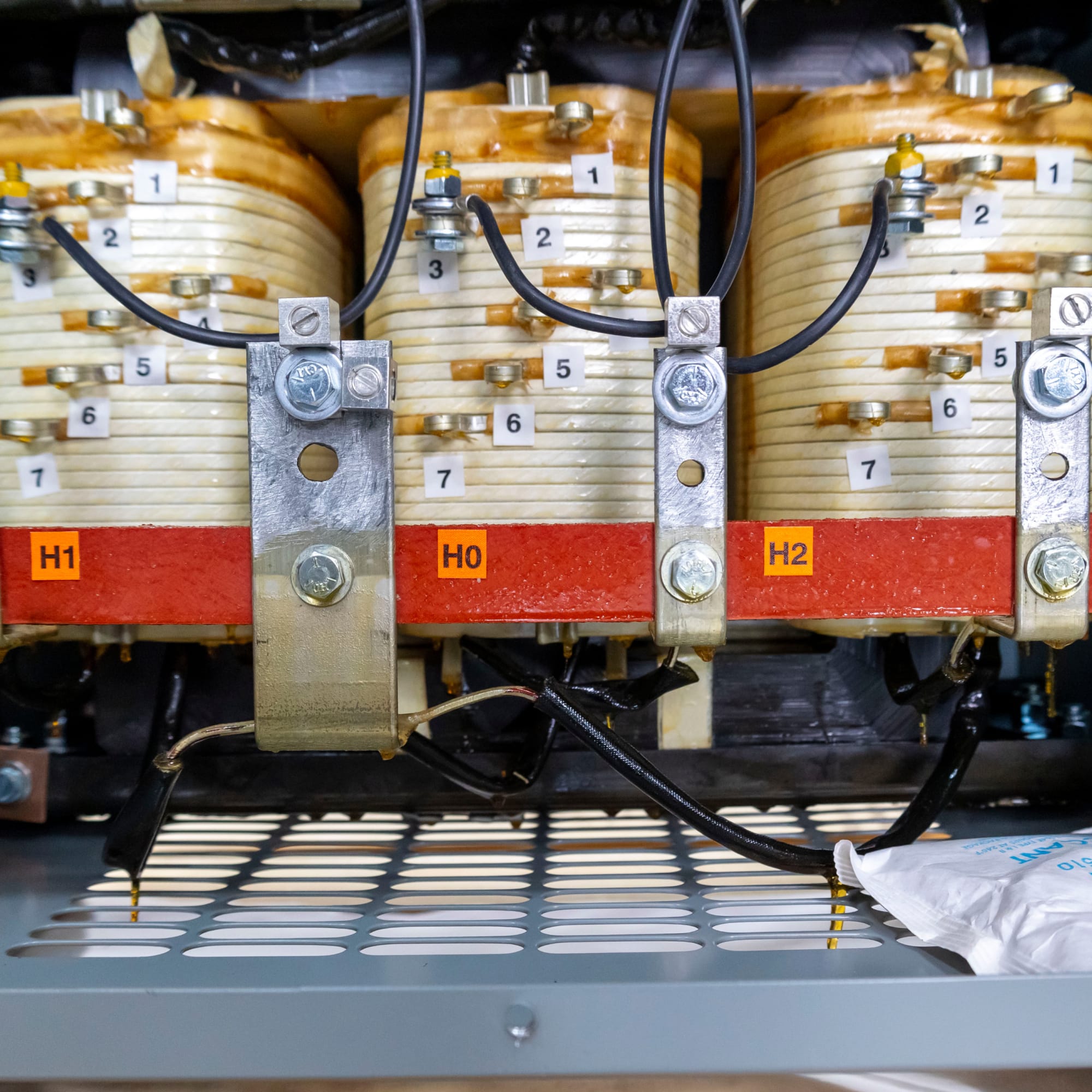 A relevant stock photo of 3 phase transformer in a typical setting.
