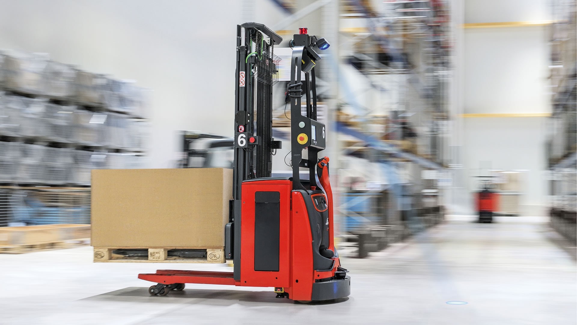 A relevant stock photo of agv forklift in a typical setting.
