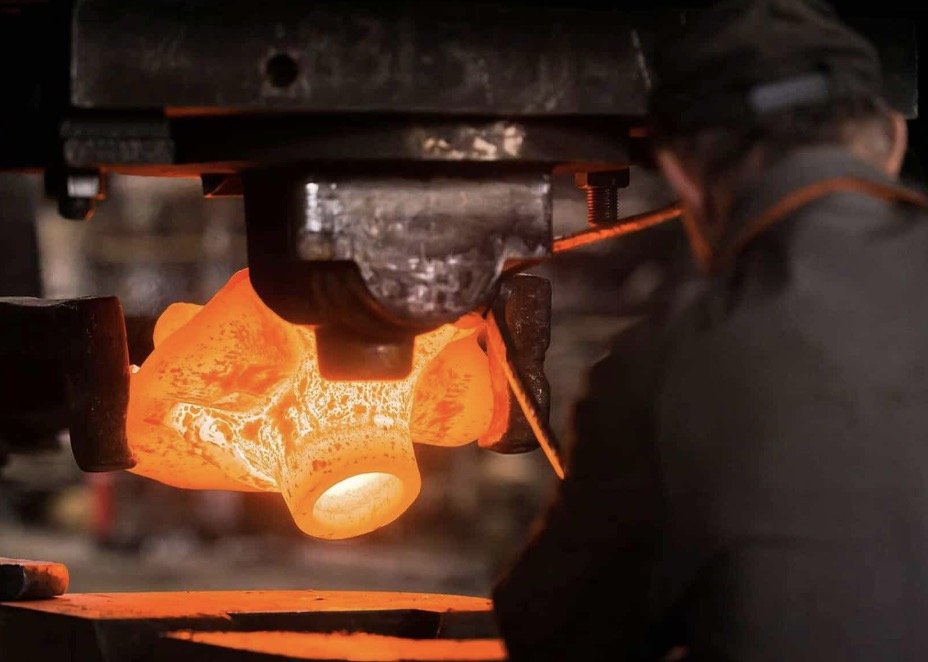 A relevant stock photo of aluminum forging in a typical setting.