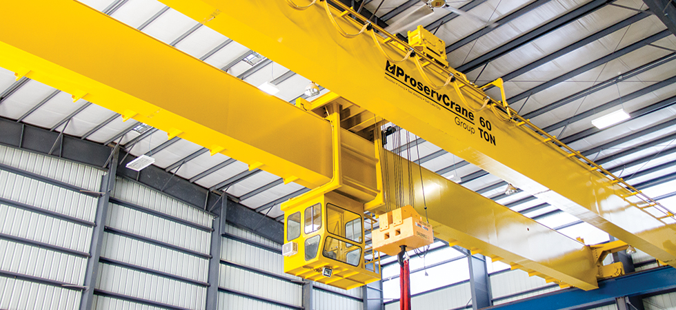 A relevant stock photo of bridge crane in a typical setting.