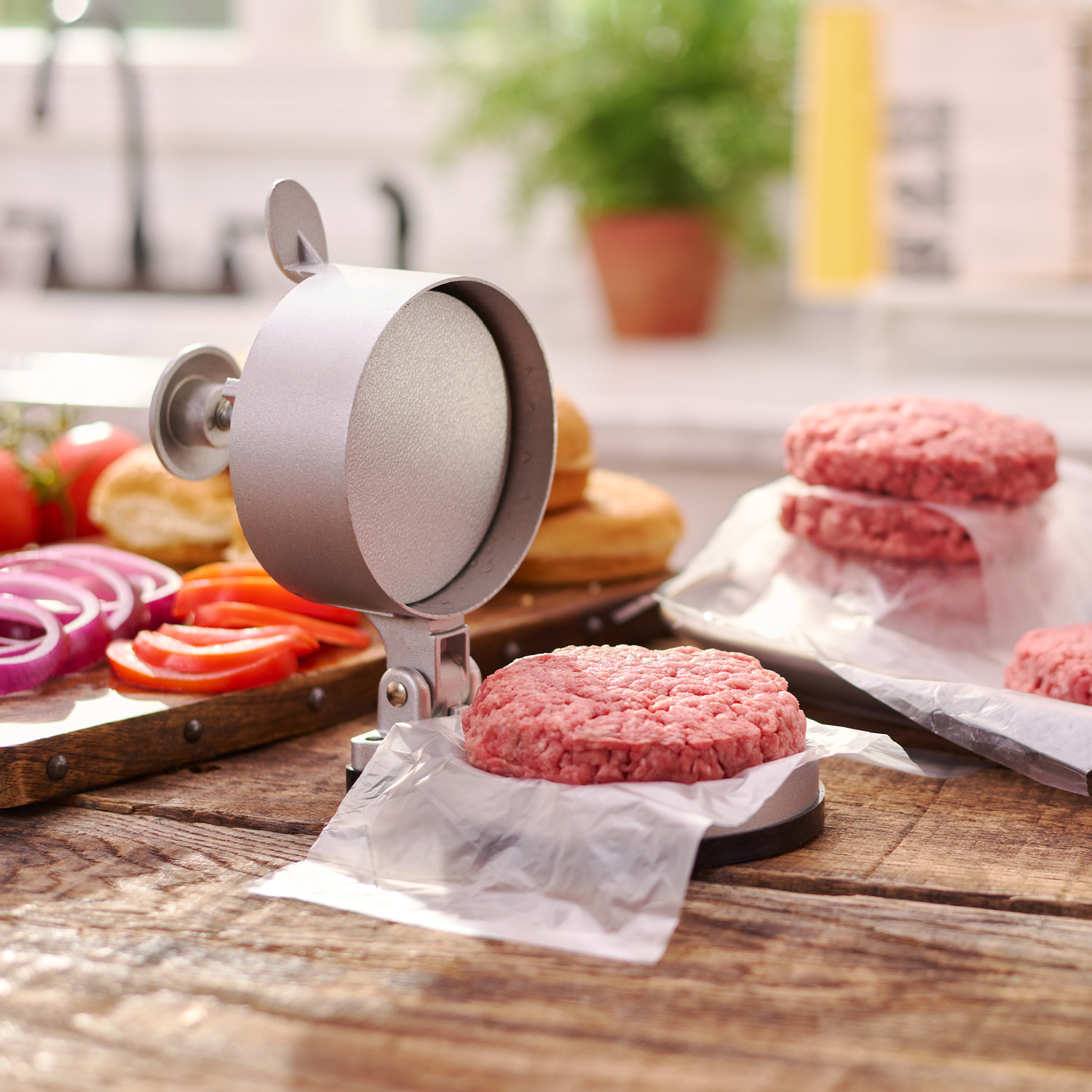 A relevant stock photo of burger press in a typical setting.