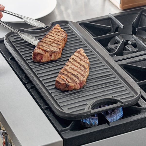 A relevant stock photo of cast iron griddle in a typical setting.