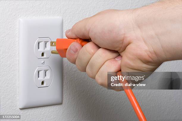 A relevant stock photo of electric plugs in a typical setting.