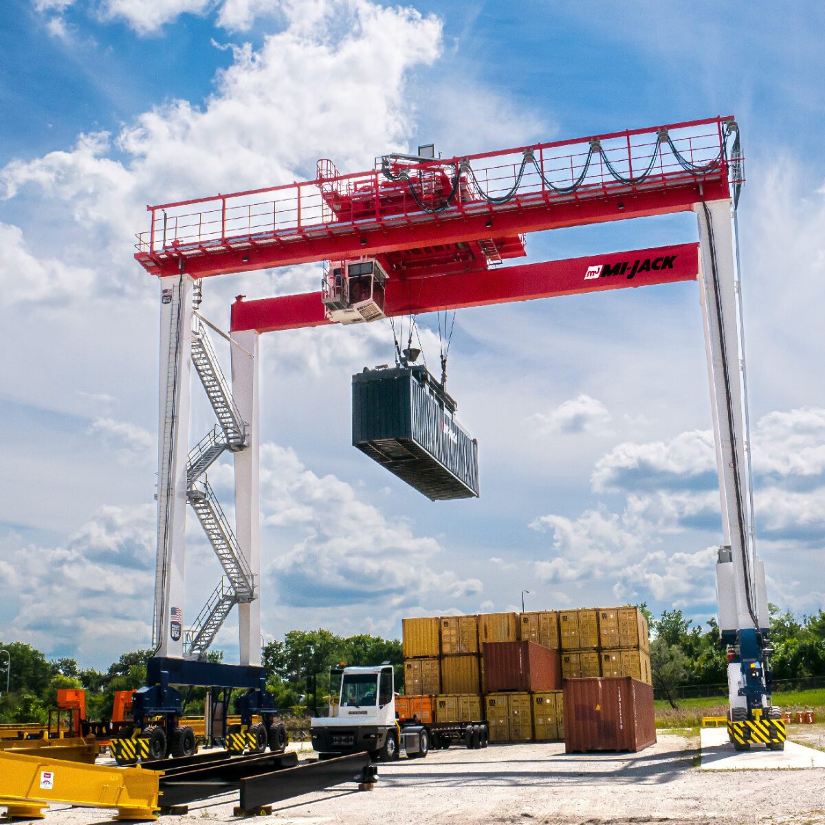 A relevant stock photo of gantry cranes in a typical setting.