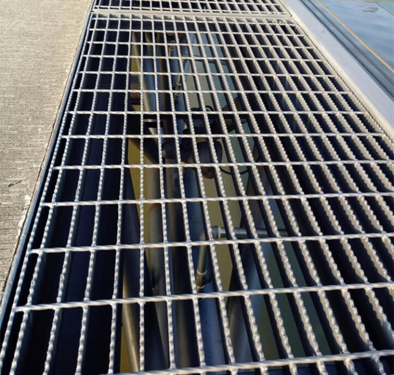 A relevant stock photo of metal grate in a typical setting.