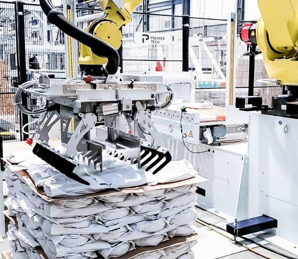 A relevant stock photo of palletizing robot in a typical setting.