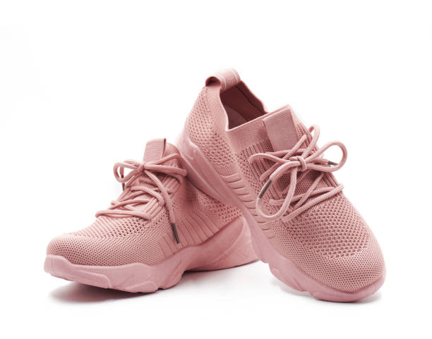 A relevant stock photo of pink sneakers in a typical setting.