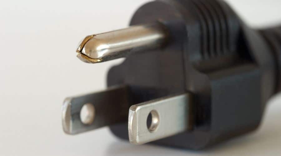 A relevant stock photo of plug in prongs in a typical setting.