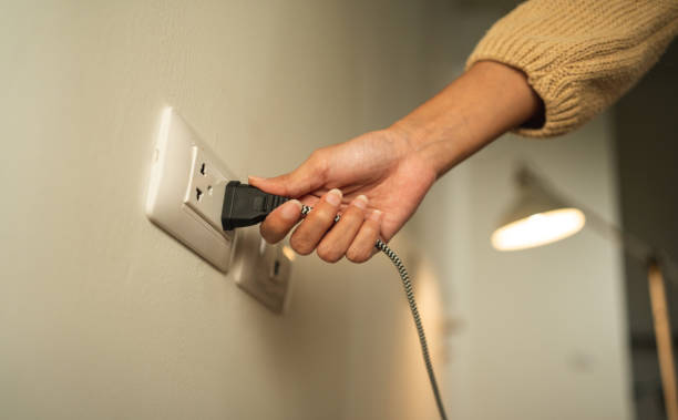 A relevant stock photo of plugging electrical in a typical setting.