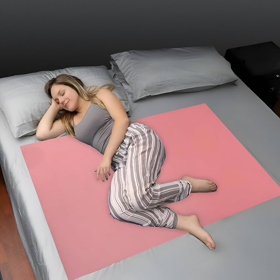 A relevant stock photo of rubber bed sheets in a typical setting.