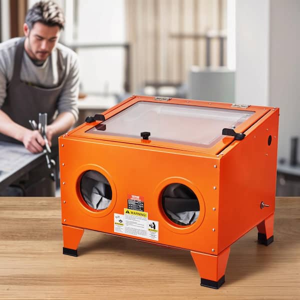 A relevant stock photo of sand blast cabinet in a typical setting.