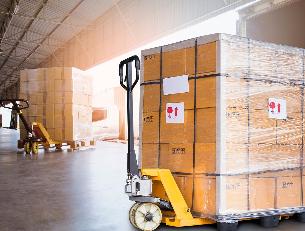 A relevant stock photo of shipping palate in a typical setting.