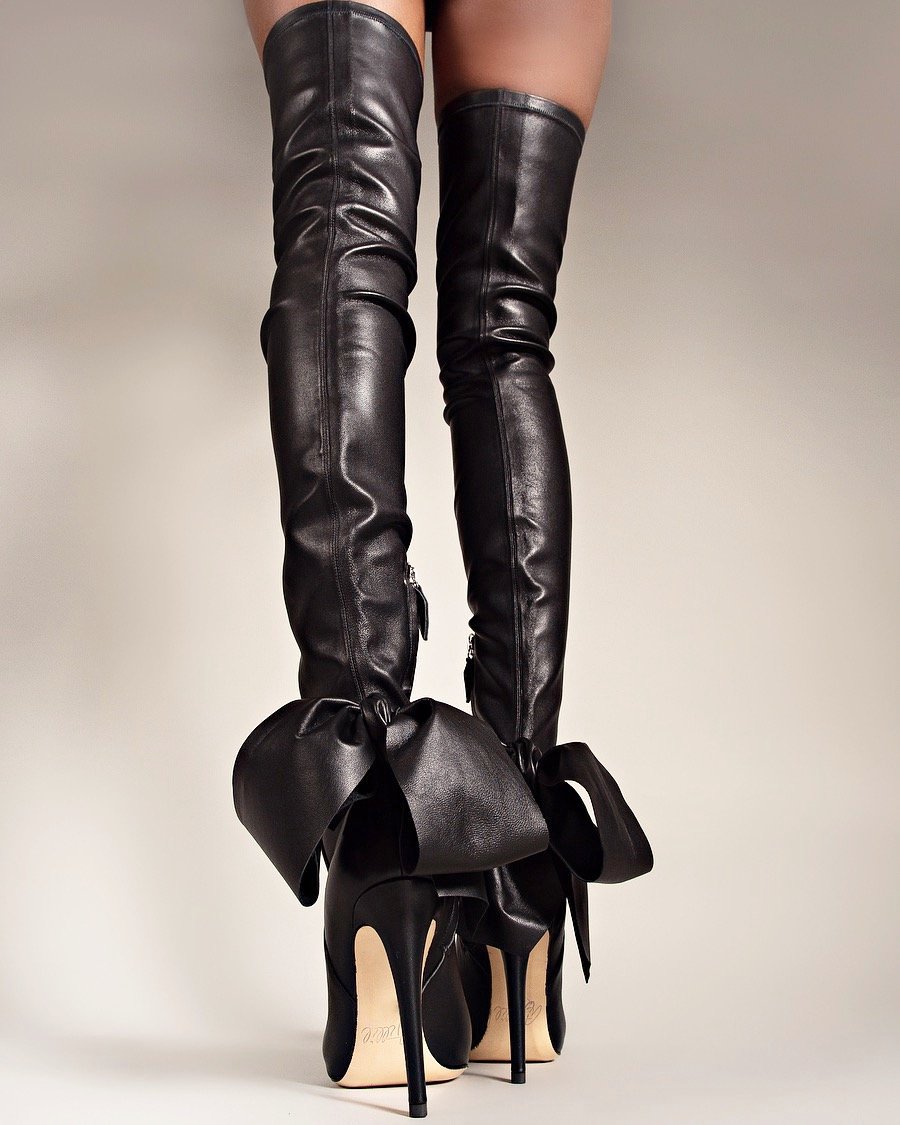 A relevant stock photo of thigh high boots in a typical setting.