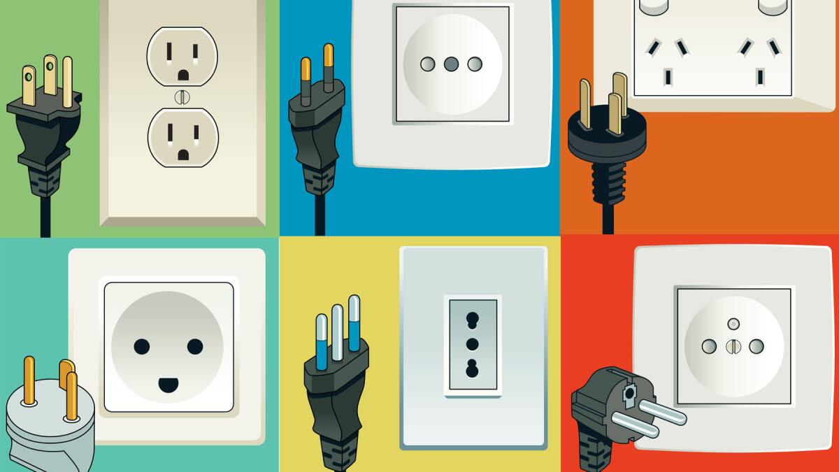 A relevant stock photo of type of electric plugs in a typical setting.
