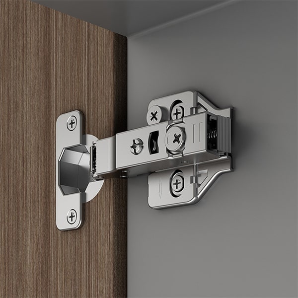 A relevant stock photo of types of cabinet hinges in a typical setting.