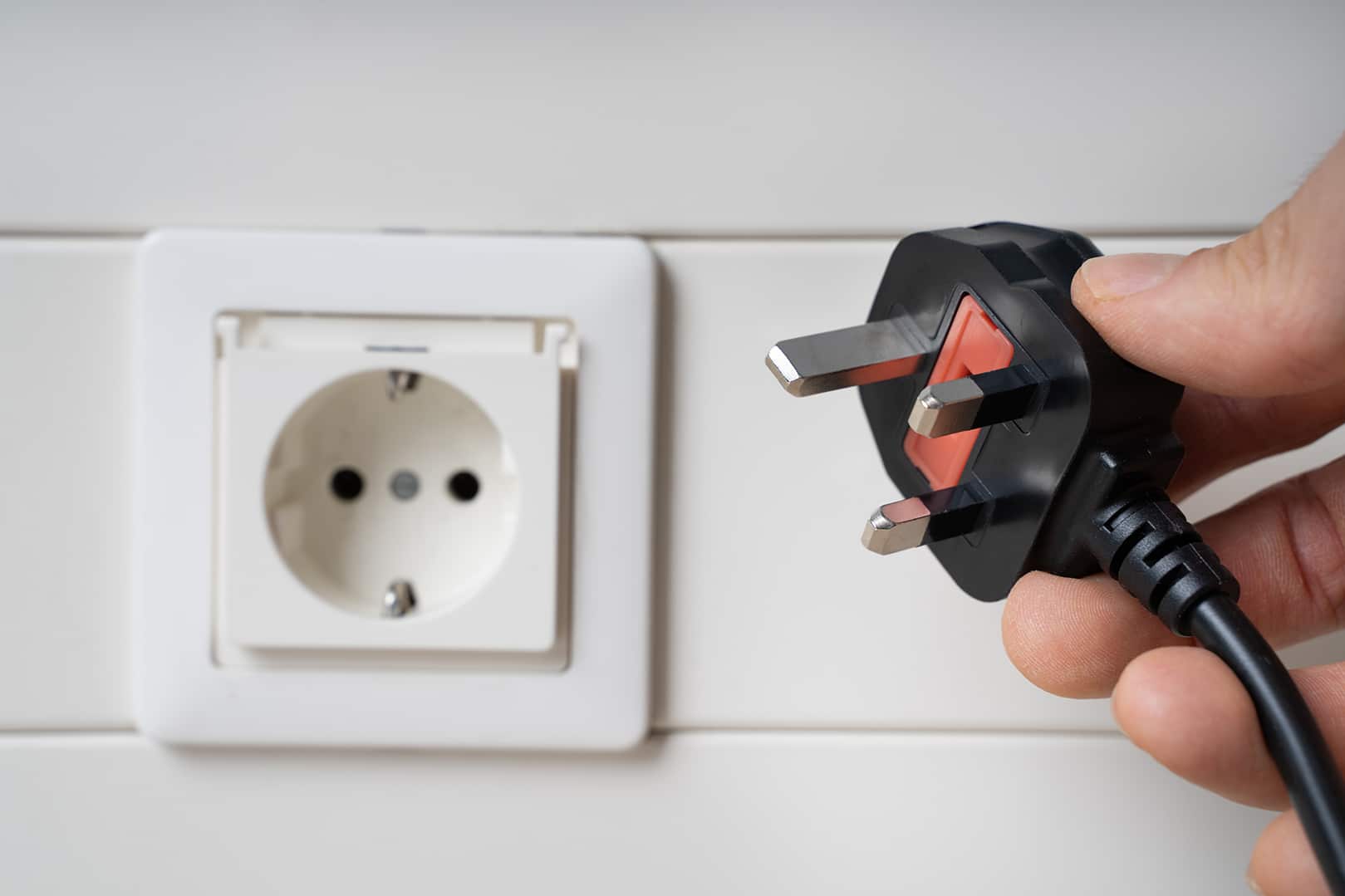 A relevant stock photo of us mains socket in a typical setting.
