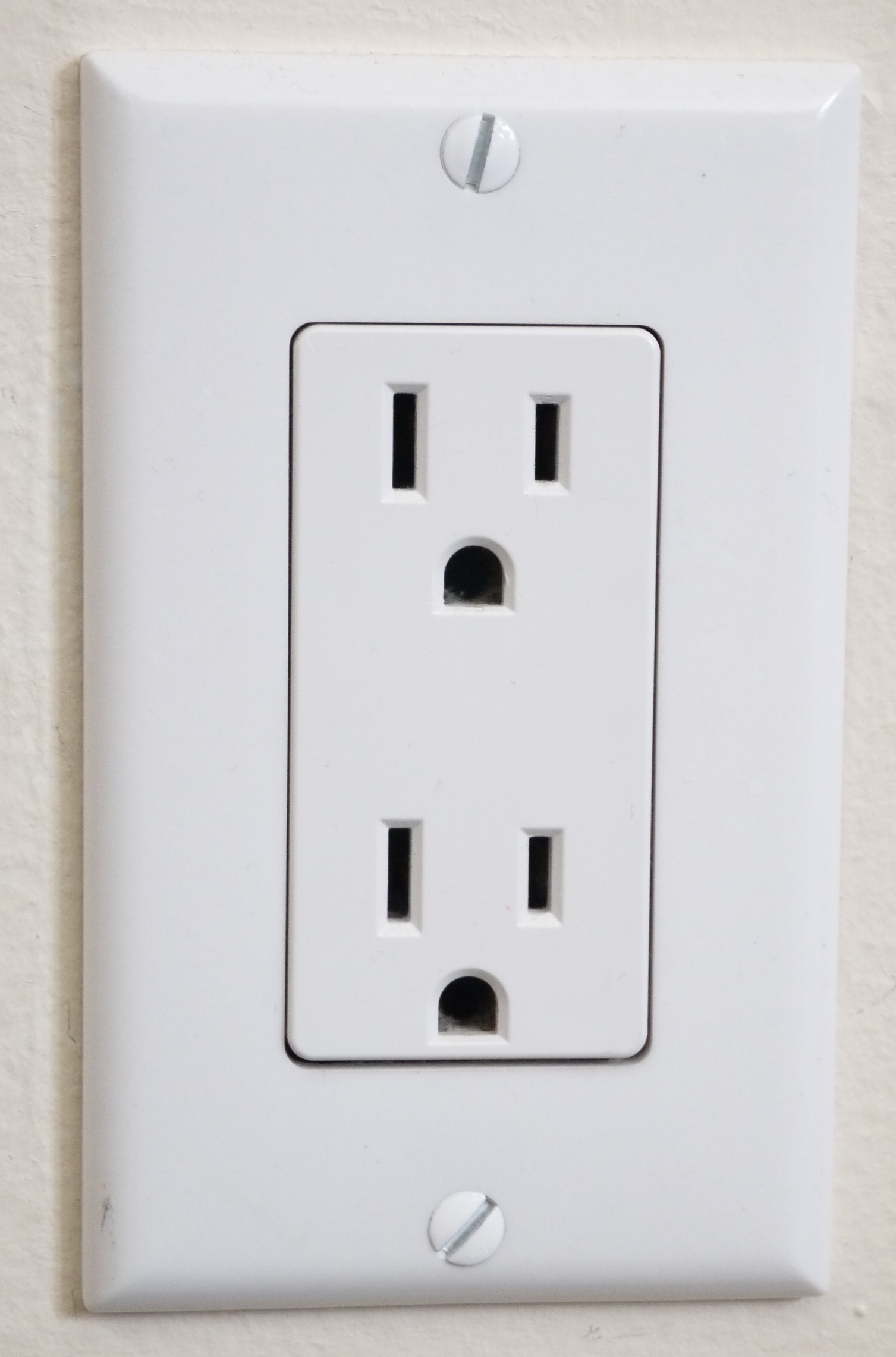 A relevant stock photo of usa electrical socket in a typical setting.
