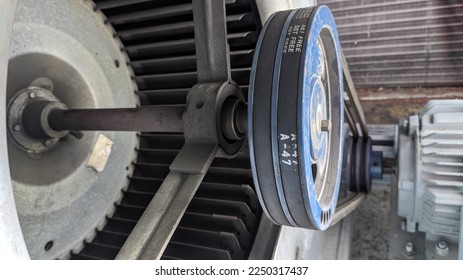 A relevant stock photo of vee belt and pulley in a typical setting.