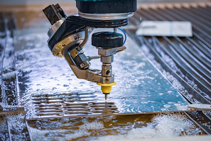 A relevant stock photo of water jet cutter in a typical setting.